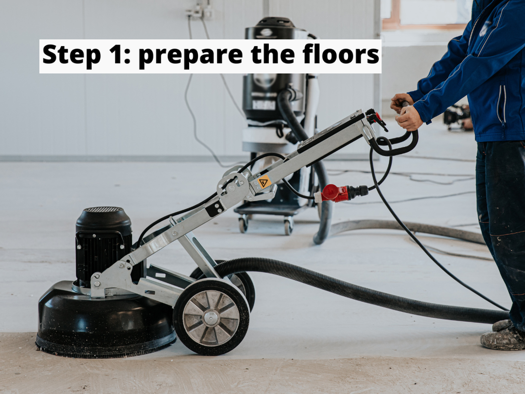 Preparing the concrete floor for epoxy coating.